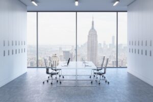 Empty board room with view of the Empire State building out of the window